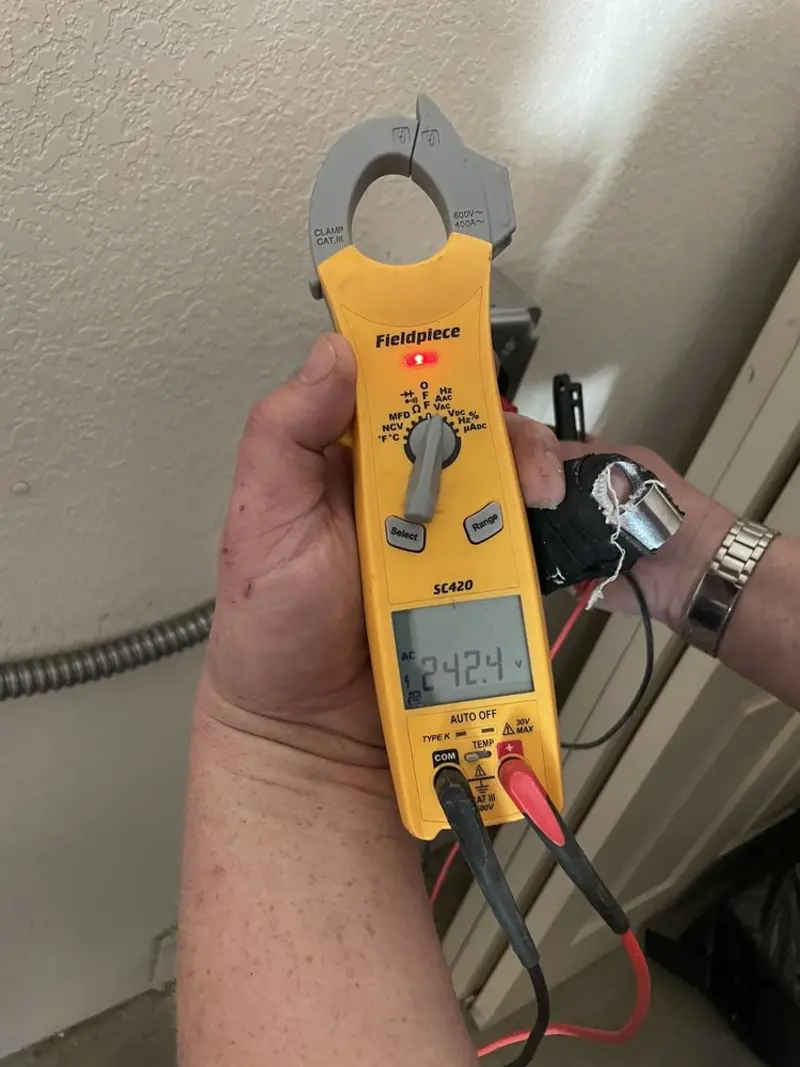 Voltage testing with clamp meter during Whole House Surge Protector in Doylestown